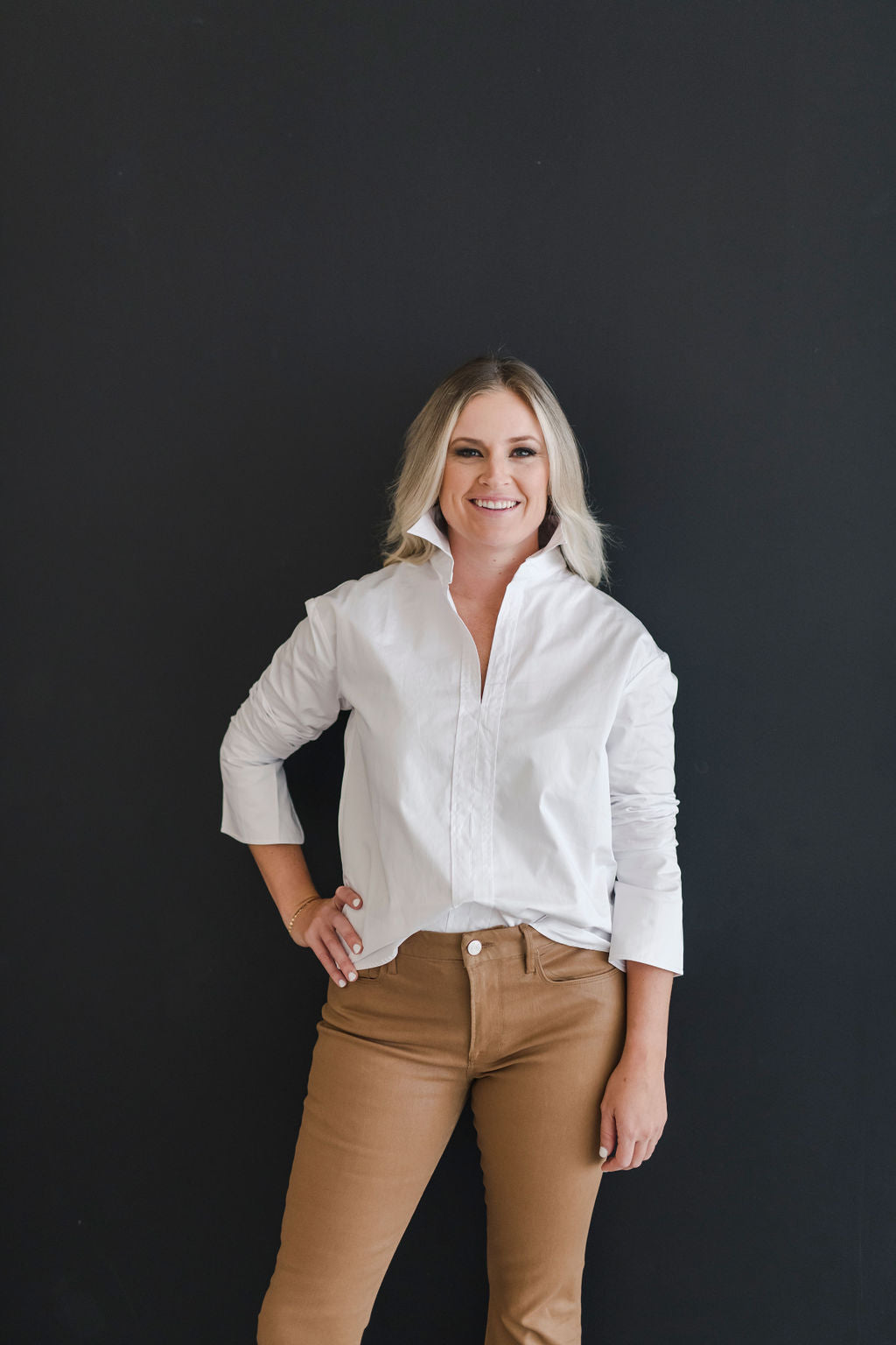 White, crisp long sleeve shirt with a popped collar.