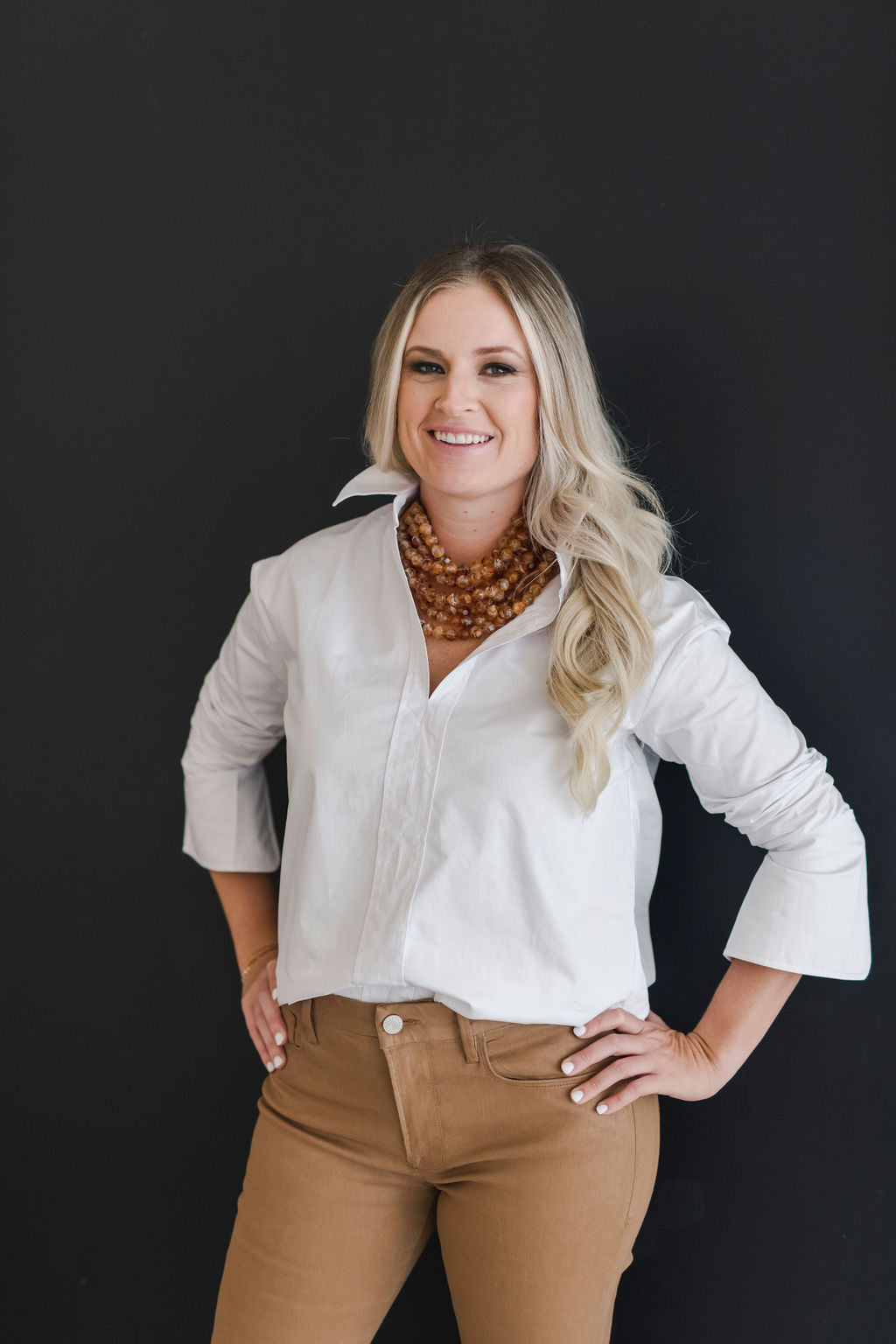 White, crisp long sleeve shirt with a popped collar.