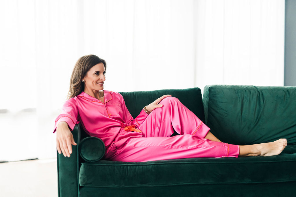 Pretty silky bright pink pajama set with bright orange contrast piping.