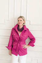 Women's belted jacket is a beautiful berry pink color with orange lining and gold buttons.