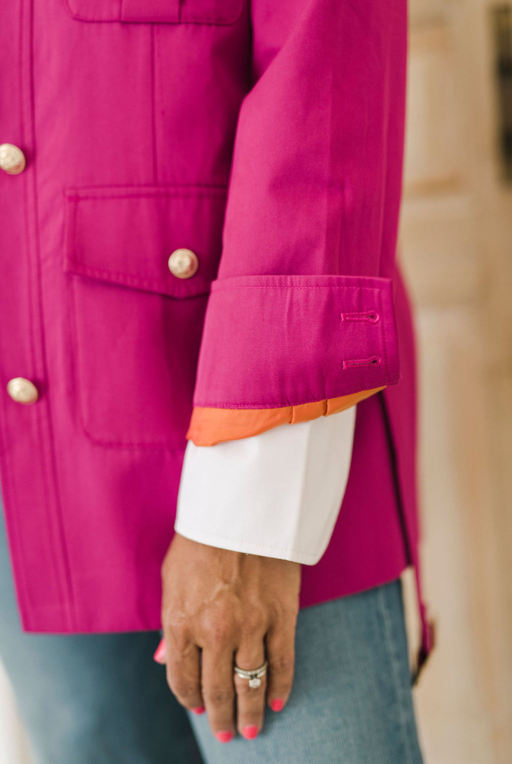 Women's belted jacket is a beautiful berry pink color with orange lining and gold buttons.