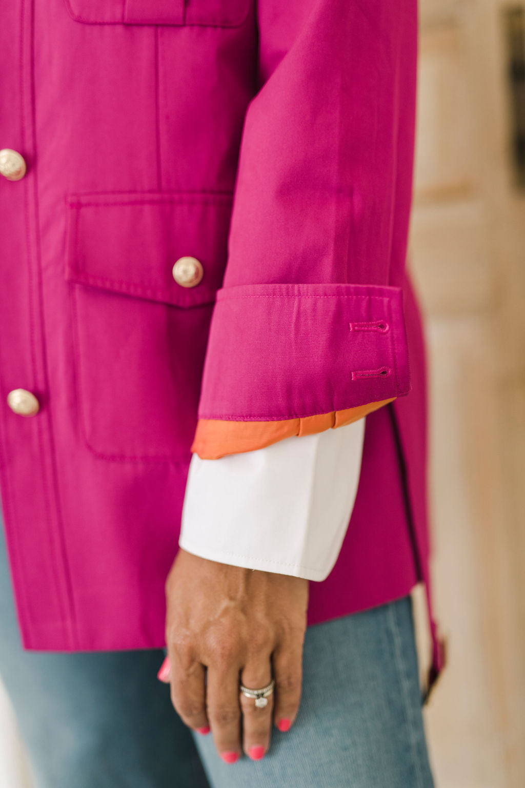 Women's belted jacket is a beautiful berry pink color with orange lining and gold buttons.