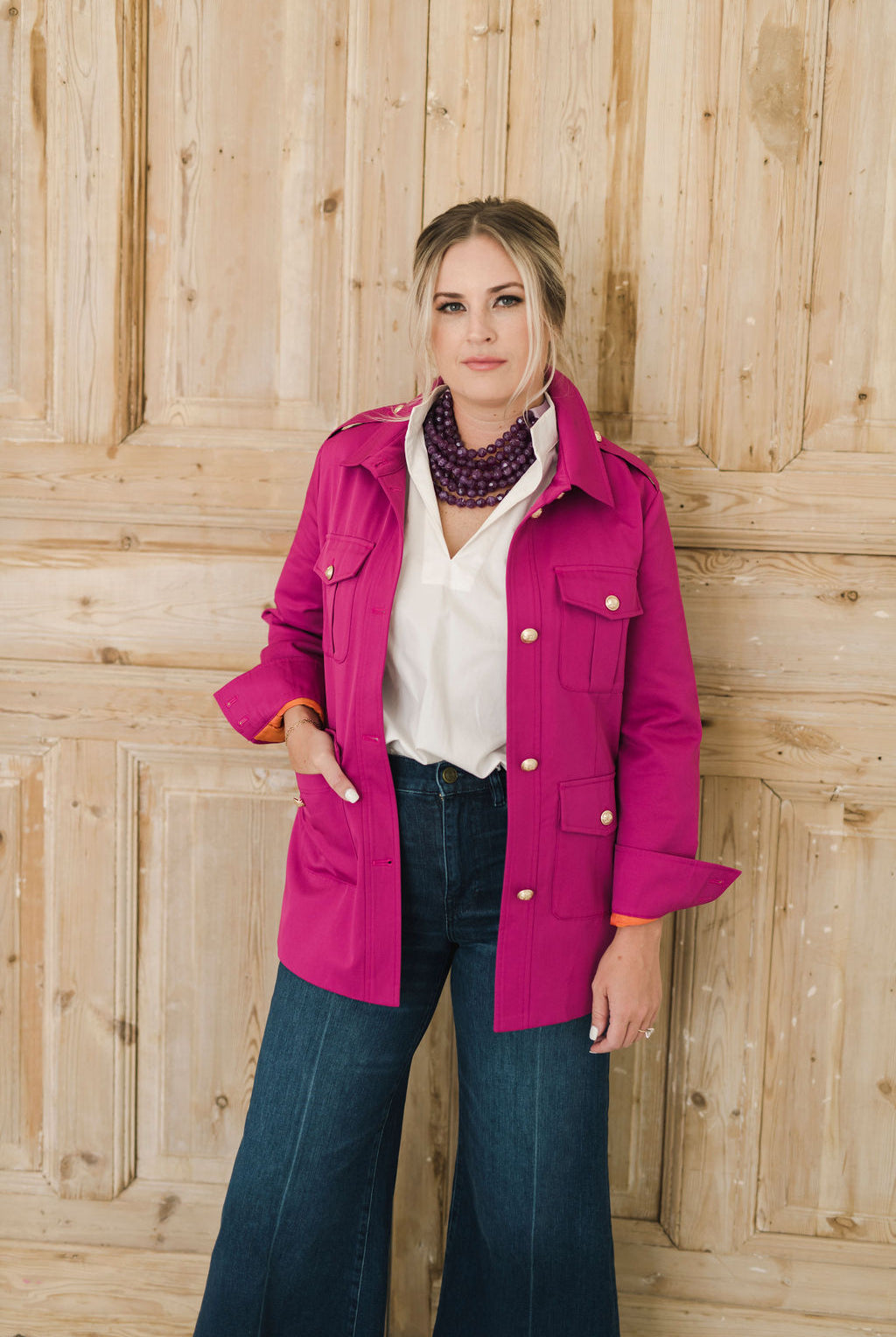 Women's belted jacket is a beautiful berry pink color with orange lining and gold buttons.