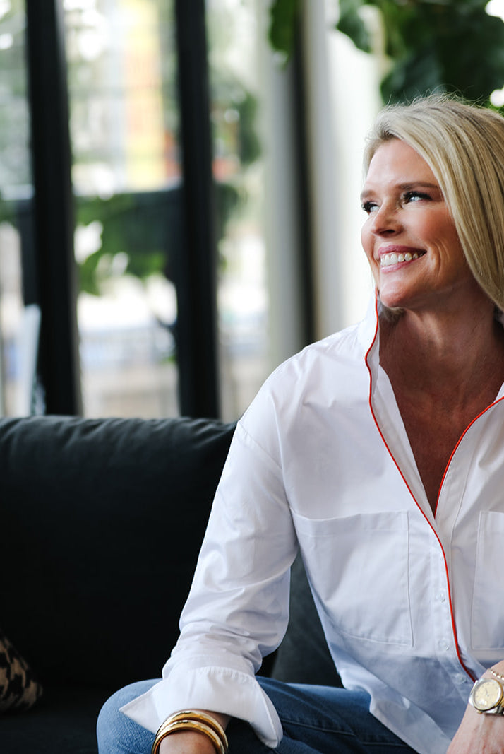 Woman sitting on a couch in a modern living room