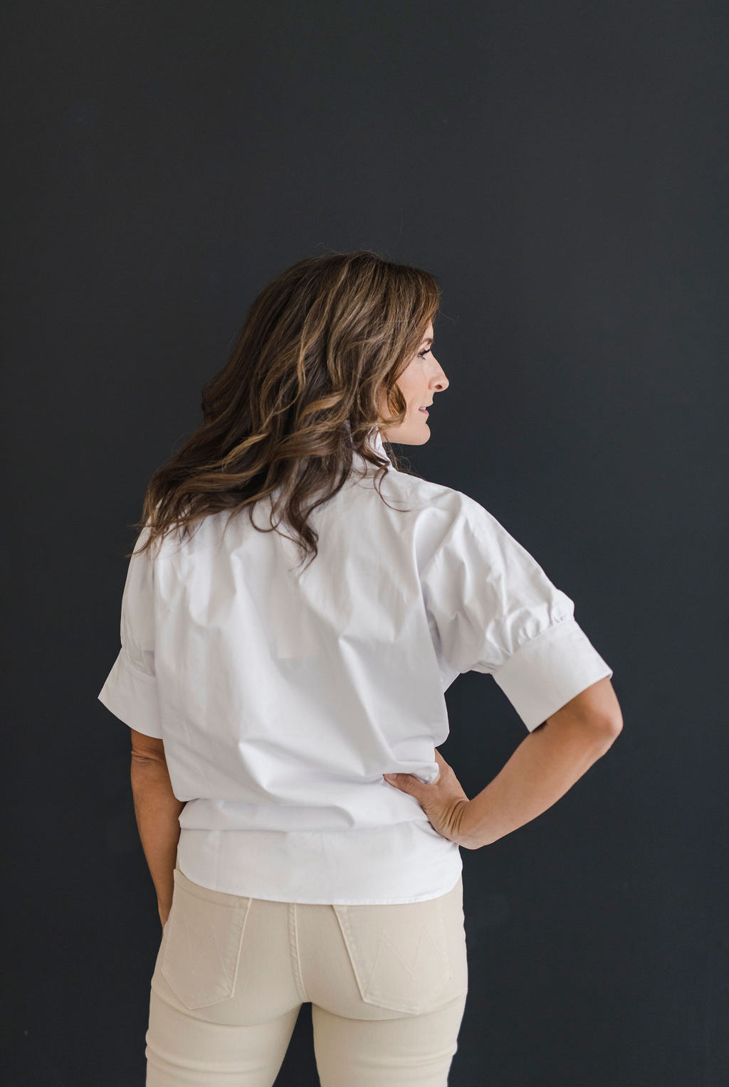 Crisp white short sleeve shirt with a fun ruffle collar.