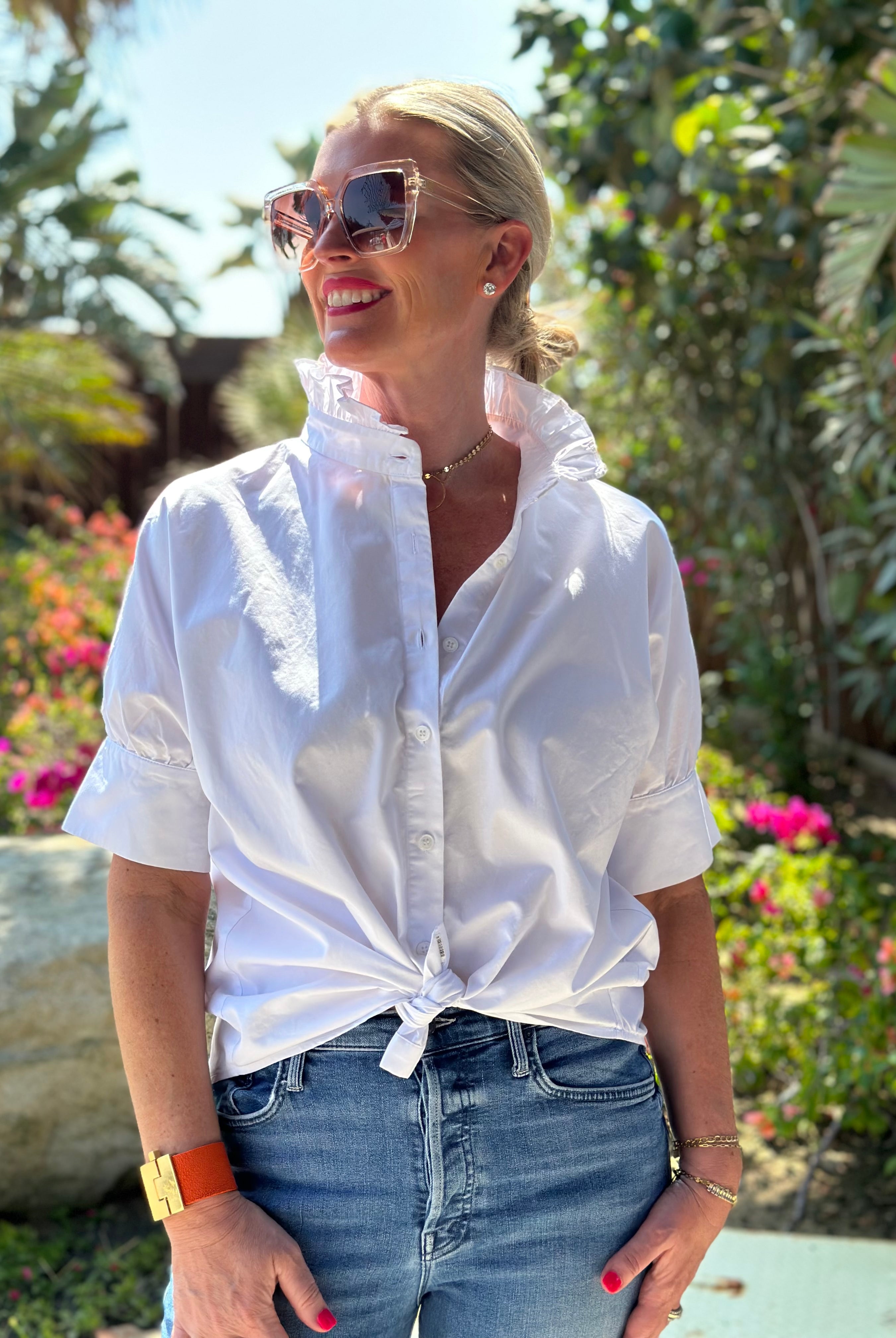 Crisp white short sleeve shirt with a fun ruffle collar.