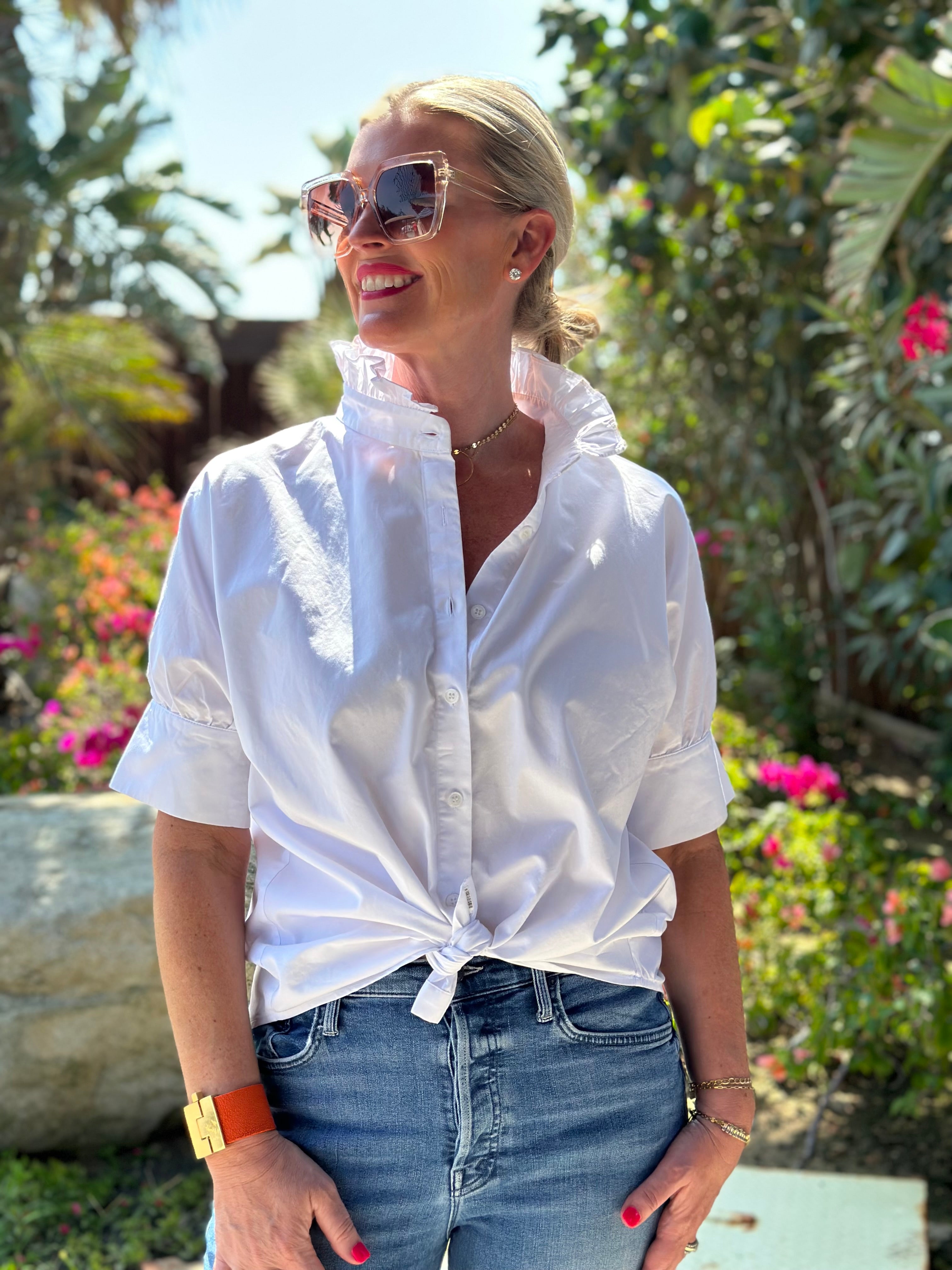 Crisp white short sleeve shirt with a fun ruffle collar.