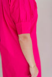 Button down shirt dress in hot pink.  Ruffle collar with elbow length sleeves.