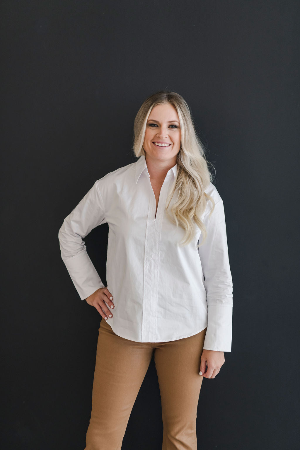 White, crisp long sleeve shirt with a popped collar.