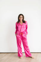 Pretty silky bright pink pajama set with bright orange contrast piping.
