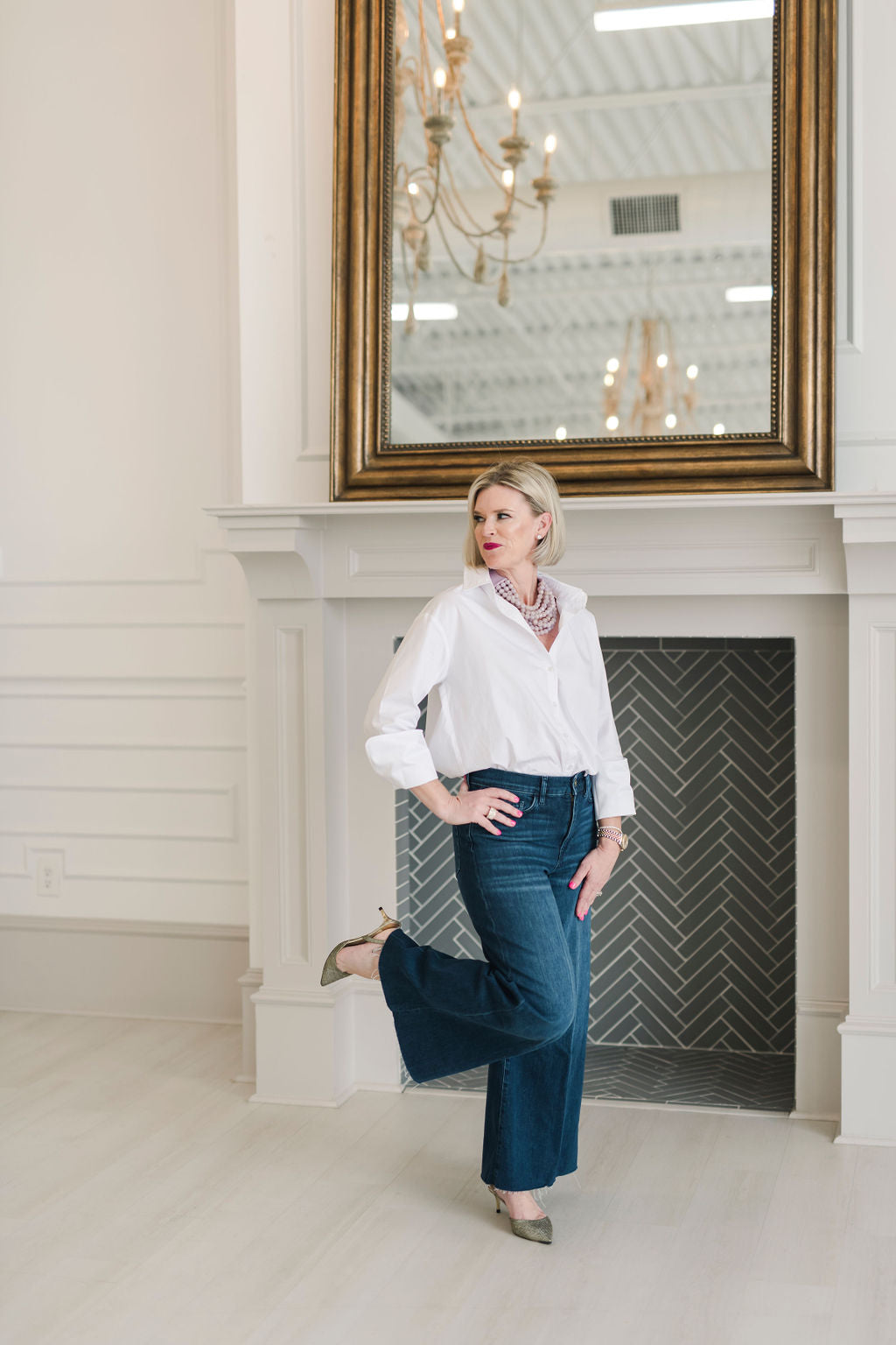 Crisp white women's button down shirt. Worn with jeans and jewlery.