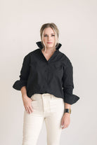 Crisp and classic women's button down shirt in black.