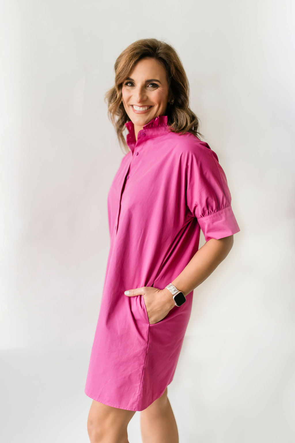 Berry pink women's button down dress with short sleeves and a ruffle collar.