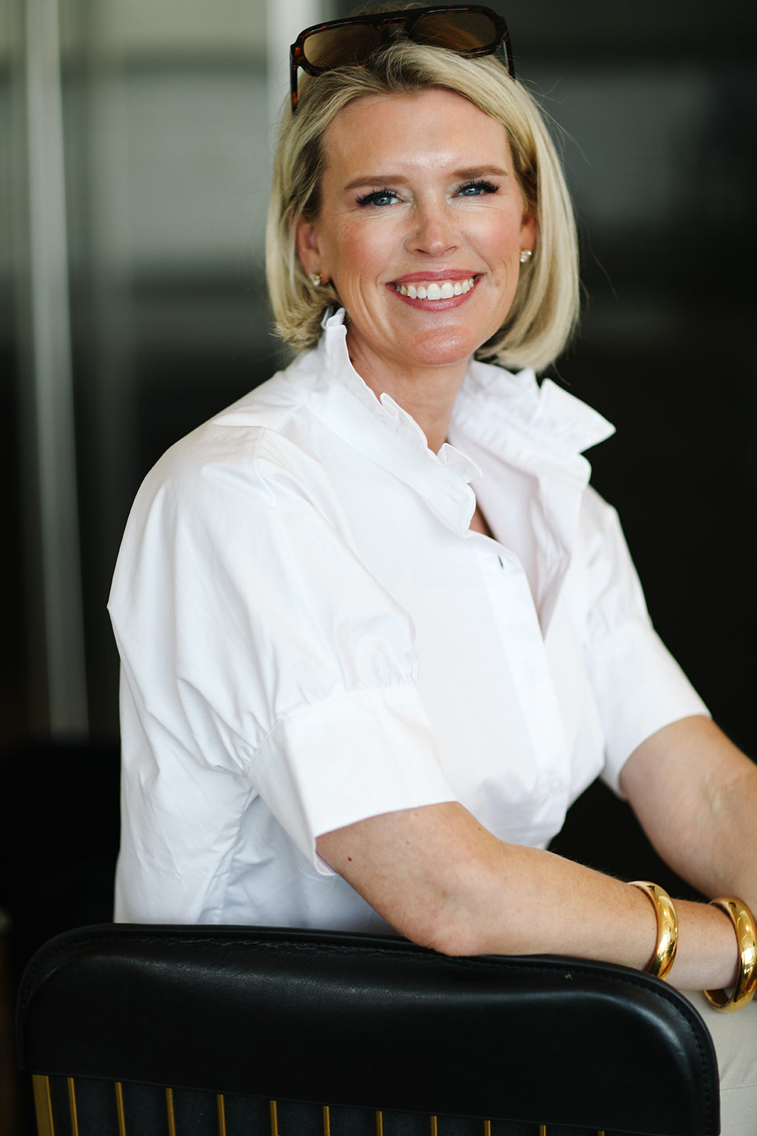 Woman wearing a white blouse with a blurred background