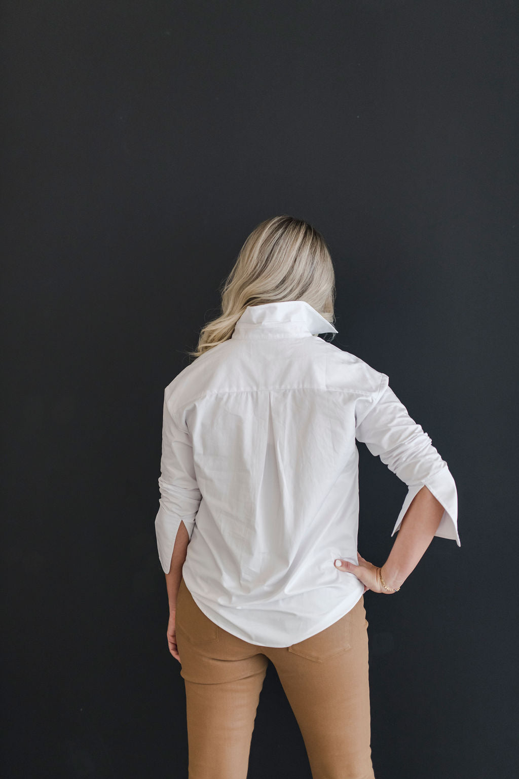 White, crisp long sleeve shirt with a popped collar.
