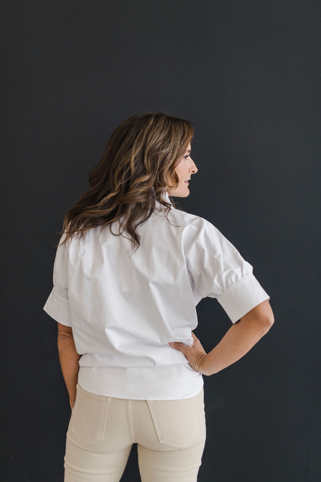 Crisp white short sleeve shirt with a fun ruffle collar.