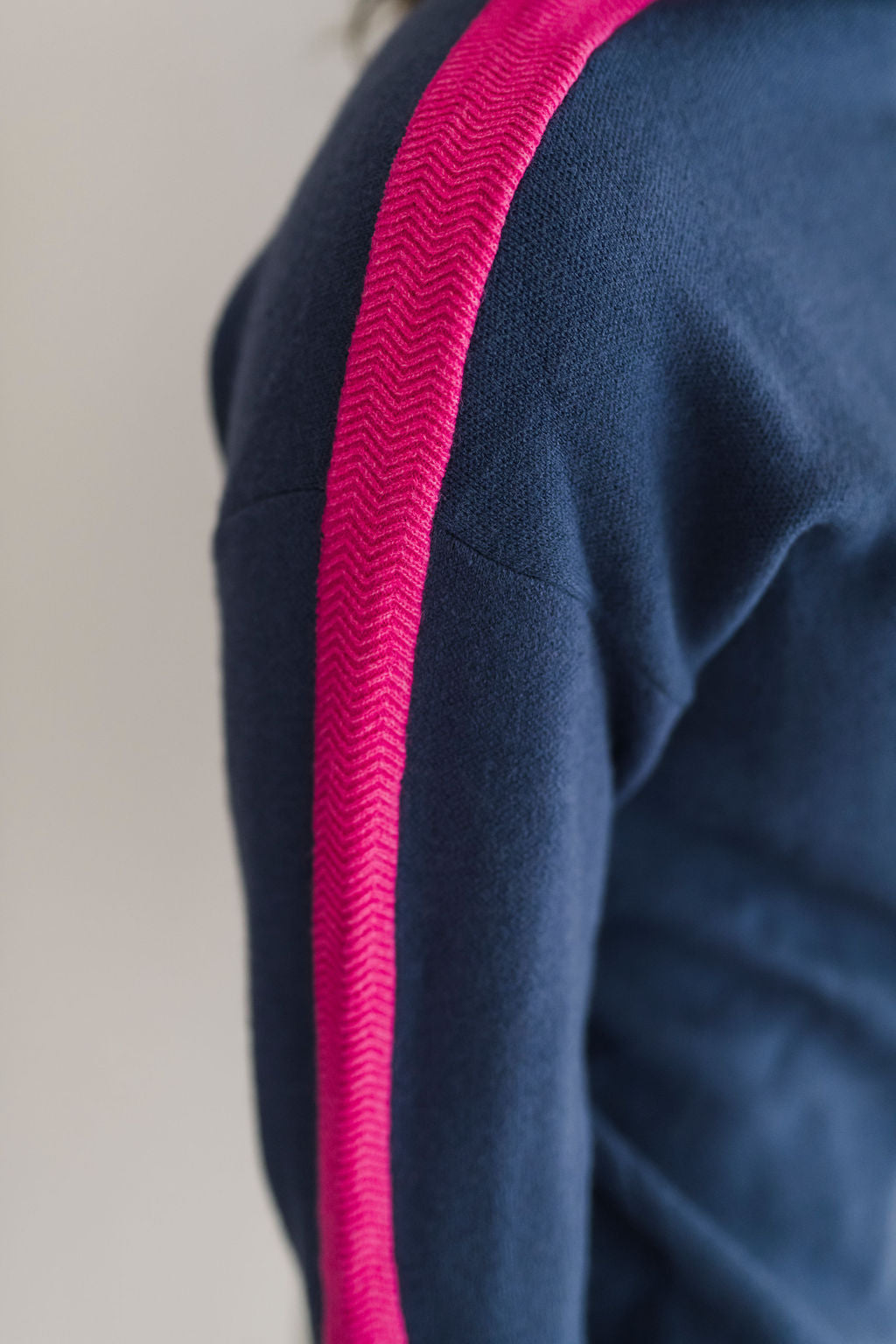 A cozy navy and pink colorblocked turtleneck sweater.