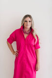 Button down shirt dress in hot pink.  Ruffle collar with elbow length sleeves.